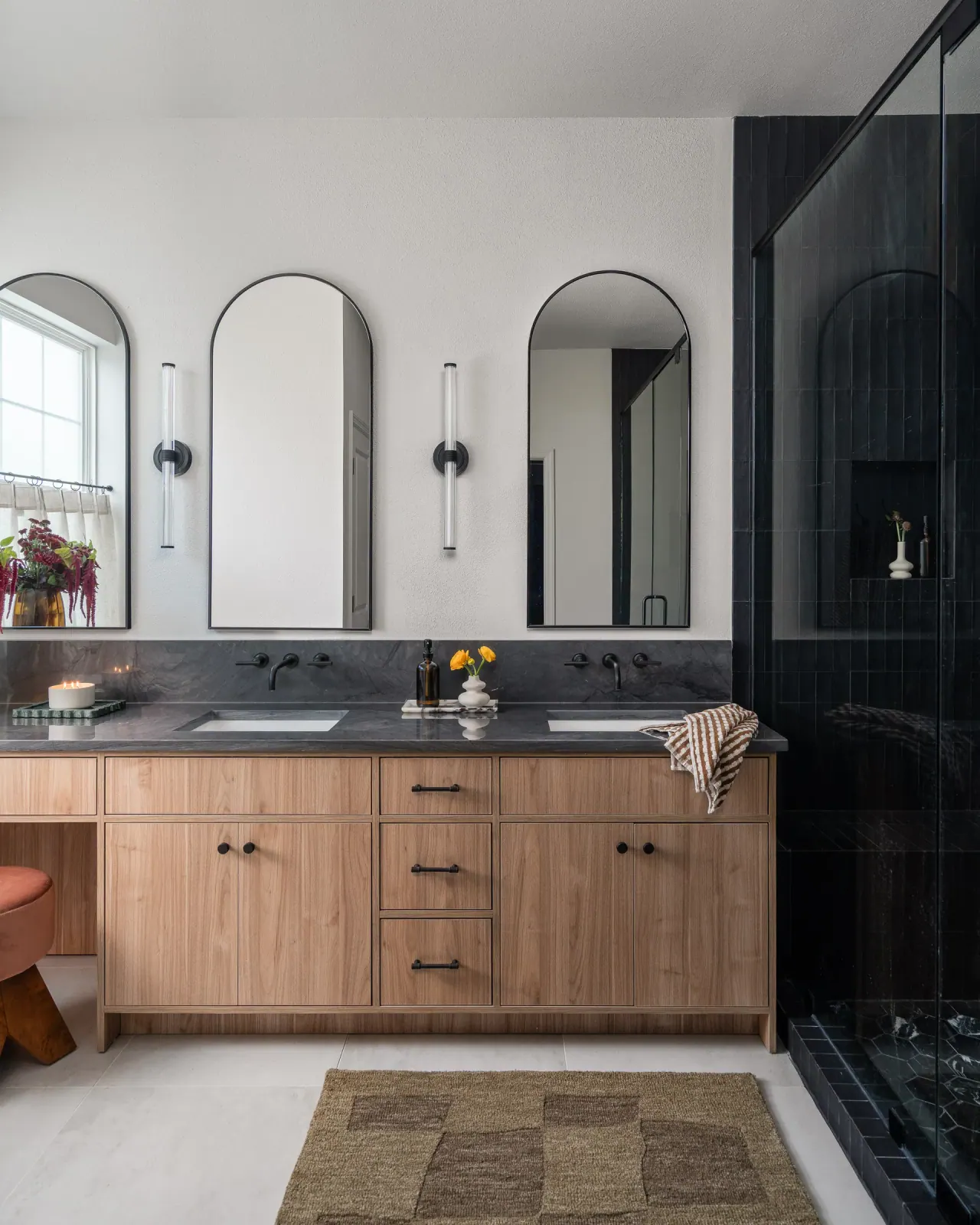Arched mirrors over a white oak double vanity